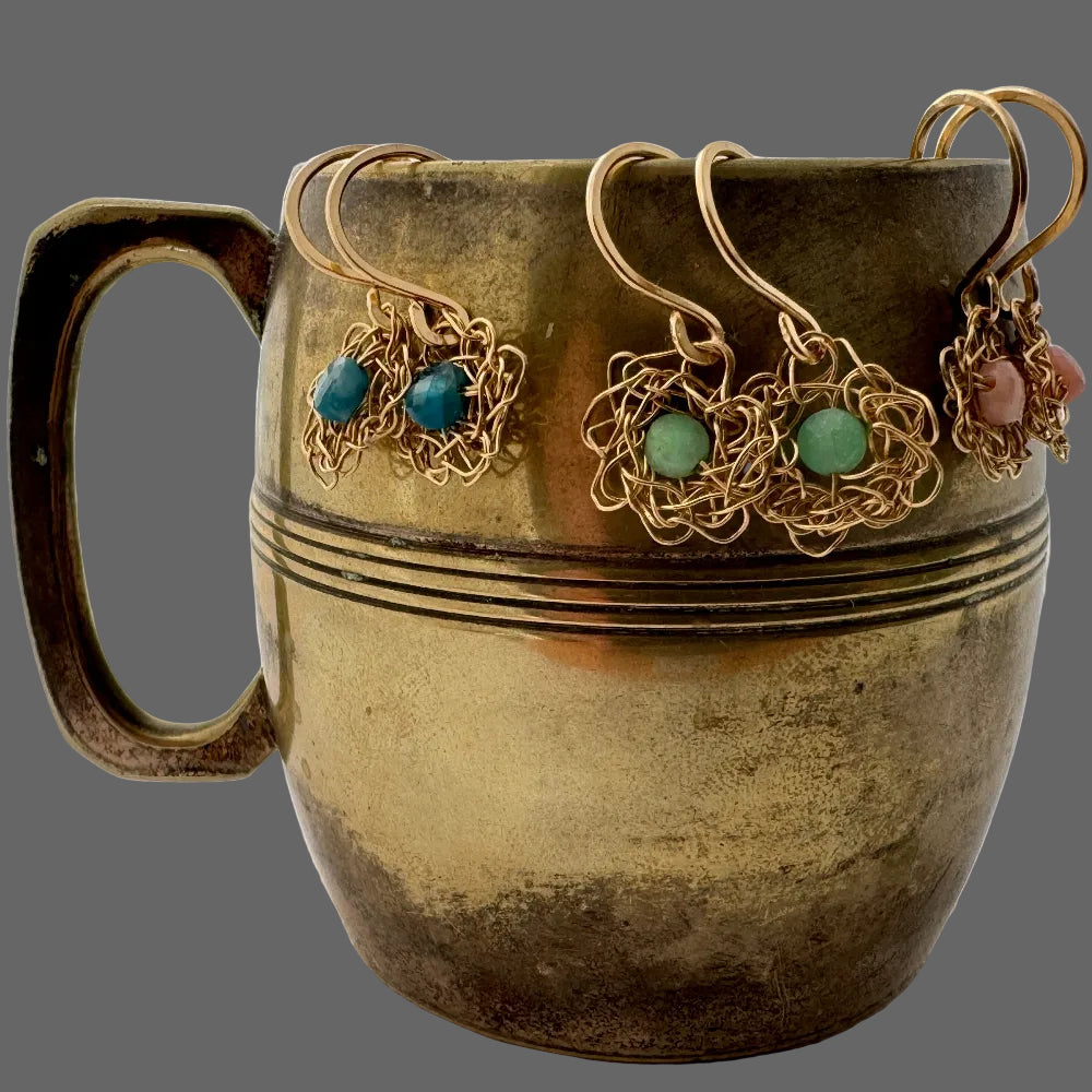 Bronze mug with decorative elements on a white background