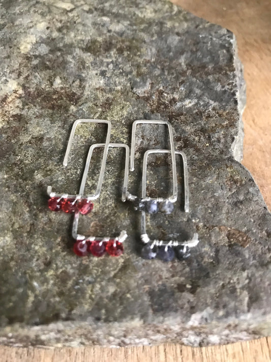Geometric thread through earrings with garnet