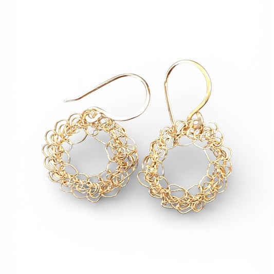 Gold hoop earrings on a white background