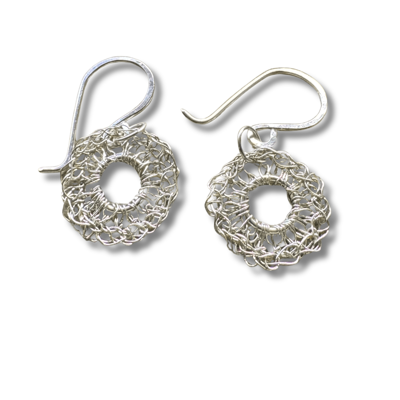 Pair of silver earrings on a white background